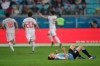 Uruguay's Diego Laxalt lying on the pitch as Japan players celebrate their side's first goal during a Copa America Group C soccer match at the Arena Gremio in Porto Alegre, Brazil, Thursday, June 20, 2019. (AP Photo/Edison Vara)