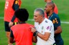 Brazil's coach Tite speaks with his player Willian, left, as Fernandinho walks behind, during a training session by the national soccer team in Sao Paulo, Brazil, Sunday, June 23, 2019. Brazil will play on June 27 a quarterfinals match at the Copa America soccer tournament. (AP Photo/Nelson Antoine)