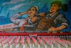 In this Tuesday, July 16, 2019, photo, North Koreans hold cards to make an image depicting a worker and a farmer during a mass game performance of 