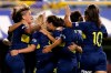 Boca Juniors' Noelia Espindola, not seen, celebrates scoring against Lanus with teammates during the Superliga women's tournament in Buenos Aires, Argentina, Saturday, March 9, 2019. The women competed in one of Argentina's most famous stadiums on Saturday, a milestone for the female players who are fighting for the same rights as male soccer players in the country's most popular sport. (AP Photo/Natacha Pisarenko)