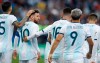 Argentina's Lionel Messi, second left, looks on after teammate Sergio Aguero scored his side's opening goal against Chile during Copa America third-place soccer match at the Arena Corinthians in Sao Paulo, Brazil, Saturday, July 6, 2019. (AP Photo/Victor R. Caivano)