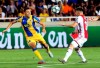 Ajax's Razvan Marin, right, challenges for the ball with APOEL's Uros Matic during the Champions League qualifying play-off first leg soccer match between APOEL Nicosia and AFC Ajax at GSP stadium in Nicosia, Cyprus, Tuesday, Aug. 20, 2019.(AP Photo/Philippos Christou)