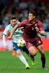 Argentina's Lionel Messi, left, fights for the ball with Venezuela's Yordan Osorio during an international friendly soccer match between Argentina and Venezuela at Wanda Metropolitano stadium in Madrid, Spain, Friday, March 22, 2019. (AP Photo/Bernat Armangue)