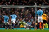 Manchester City's Gabriel Jesus, left, scores with penalty against Wolverhampton Wanderers during the English Premier League soccer match between Manchester City and Wolverhampton Wanderers at the Etihad Stadium in Manchester, England, Monday, Jan. 14, 2019. (AP Photo/Dave Thompson)