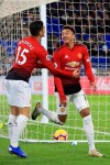 Manchester United midfielder Jesse Lingard, right, and his teammate midfielder Andreas Pereira celebrated together his goal against Cardiff City during the English Premier League match between Cardiff City and Manchester United at the Cardiff City Stadium in Cardiff, Wales, Saturday Dec. 22, 2018. (AP Photo/ Jon Super)