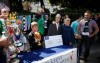 Ireland soccer supporters pose for photographs with a cardboard cut out of FIFA President Sepp Blatter, outside the Aviva stadium, prior to the start of the international friendly soccer match between Ireland and England, in Dublin, Ireland, Sunday, June 7, 2015. (AP Photo/Peter Morrison)
