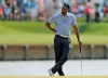 Tiger Woods reacts to hitting his drive into the water on the 17th hole during the second round of The Players Championship golf tournament Friday, March 15, 2019, in Ponte Vedra Beach, Fla. (AP Photo/Gerald Herbert)