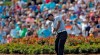 Tiger Woods hits from the drop zone after hitting his tee shot into the water on the 17th hole during the second round of The Players Championship golf tournament Friday, March 15, 2019, in Ponte Vedra Beach, Fla. (AP Photo/Gerald Herbert)