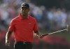 Tiger Woods looks toward the crowd as he makes par on the 17th hole during the final round of The Players championship golf tournament at TPC Sawgrass, Sunday, May 12, 2013, in Ponte Vedra Beach, Fla. TIger Woods won The Players Championship. (AP Photo/John Raoux)