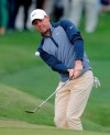 Rory McIlroy, of Northern Ireland, chips to the ninth green during the final round of The Players Championship golf tournament Sunday, March 17, 2019, in Ponte Vedra Beach, Fla. (AP Photo/Gerald Herbert)