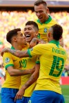 Brazil's Roberto Firmino, center, celebrates with teammates scoring his side's second goal against Peru during a Copa America Group A soccer match at the Arena Corinthians in Sao Paulo, Brazil, Saturday, June 22, 2019. (AP Photo/Victor R. Caivano)