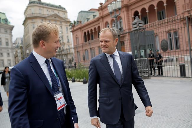 European Council's President Donald Tusk, right, leaves the presidential palace after meeting Argentina's President Mauricio Macri in Buenos Aires, Argentina, Thursday, Nov. 29, 2018. Leaders from the Group of 20 industrialized nations will meet in Buenos Aires for two days starting Friday. (AP Photo/Sebastian Pani)