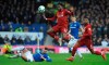 Liverpool's Divock Origi is tackled by Everton's Morgan Schneiderlin during the English Premier League soccer match between Everton and Liverpool at Goodison Park in Liverpool, England, Sunday, March 3, 2019. (AP Photo/Rui Vieira)