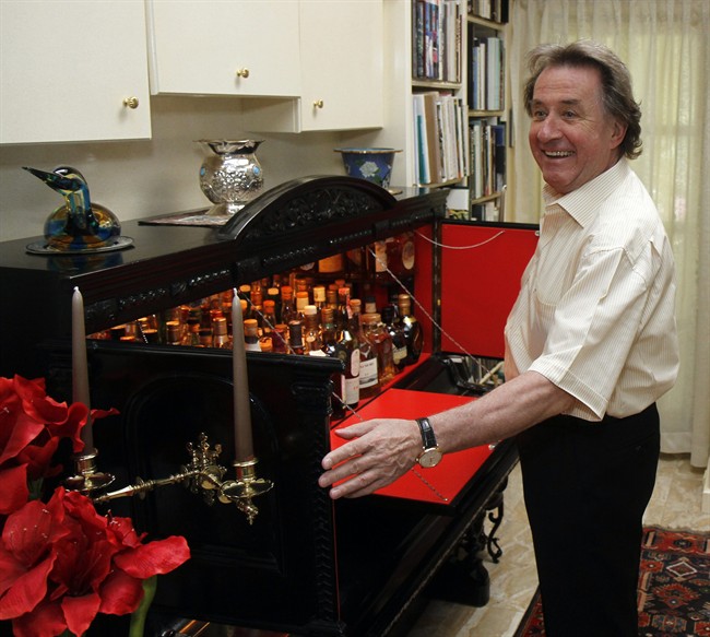 Austrian pianist Rudolf Buchbinder presents his piano-shaped bar during an interview with The Associated Press in Vienna, Austria. (AP Photo/Ronald Zak)