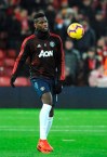 Manchester United's Paul Pogba warms up prior to the English Premier League soccer match between Liverpool and Manchester United at Anfield in Liverpool, England, Sunday, Dec. 16, 2018. (AP Photo/Rui Vieira)