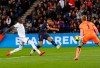 PSG's Kylian Mbappe kicks the ball ahead of Dijon goalkeeper Runar Alex Runarsson, right, and Dijon's Cedric Yambere during their League One soccer match between Paris Saint Germain and Dijon at the Parc des Princes stadium in Paris, France, Saturday, May 18, 2019. (AP Photo/Francois Mori)