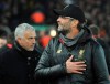 Liverpool manager Juergen Klopp, right, and Manchester United manager Jose Mourinho seen prior to the English Premier League soccer match between Liverpool and Manchester United at Anfield in Liverpool, England, Sunday, Dec. 16, 2018. (AP Photo/Rui Vieira)