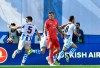 Real Sociedad's Mikel Merino, right, celebrates after scoring his side's opening goal as Real Madrid's Toni Kroos, centre, reacts during the Spanish La Liga soccer match between Real Sociedad and Real Madrid, at Anoeta stadium, in San Sebastian, northern Spain, Sunday, May 12, 2019. (AP Photo/Alvaro Barrientos)