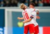 Leipzig's Diego Demme, right, celebrates with teammate Leipzig's Emil Forsberg after scoring the opening goal during the Champions League group G soccer match between Zenit St. Petersburg and RB Leipzig at the Saint Petersburg stadium in St.Petersburg, Russia, Tuesday, Nov. 5, 2019. (AP Photo/Dmitri Lovetsky)