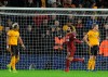 Liverpool's Mohamed Salah, centre, celebrates after scoring his side's opening goal during the English Premier League soccer match between Wolverhampton Wanderers and Liverpool at the Molineux Stadium in Wolverhampton, England, Friday, Dec. 21, 2018. (AP Photo/Rui Vieira)