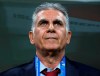 Iran's head coach Carlos Queiroz waits for the start of the AFC Asian Cup group D soccer match between Iran and Yemen at the Mohammed Bin Zayed Stadium in Abu Dhabi, United Arab Emirates, Monday, Jan. 7, 2019. (AP Photo/Hassan Ammar)