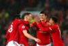 Manchester United players celebrate after Manchester United's Scott McTominay, centre, scored his side's opening goal during the English Premier League soccer match between Manchester United and Arsenal at Old Trafford in Manchester, England, Monday, Sept. 30, 2019. (AP Photo/Dave Thompson)