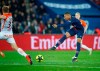 PSG's Kylian Mbappe kicks the ball ahead of Montpellier's Nicolas Cozza during the French League One soccer match between Paris Saint Germain and Montpellier at the Parc des Princes stadium in Paris, France, Wednesday, Feb. 20, 2019. (AP Photo/Francois Mori)