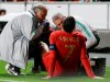 Portugal's Cristiano Ronaldo receives treatment from medical staff during the Euro 2020 group B qualifying soccer match between Portugal and Serbia at the Luz stadium in Lisbon, Portugal, Monday, March 25, 2019. (AP Photo/Armando Franca)