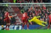 Liverpool's Alisson Becker dives but fails to stop a shot by Crystal Palace's James Tomkins during the English Premier League soccer match between Liverpool and Crystal Palace at Anfield in Liverpool, England, Saturday, Jan. 19, 2019. (AP Photo/Rui Vieira)