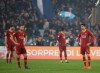 Roma players stand on the pitch in dejection after Lazio's Danilo Cataldi scores his side's third goal past of during a Serie A soccer match between Lazio and Roma at Rome's Olympic stadium, Italy, Saturday, March 2, 2019. (AP Photo/Alessandra Tarantino)