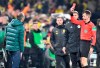 A referee Benjamin Cortus gives red card to Moenchengladbach's head coach Marco Rose, left, during the German soccer cup, DFB Pokal, second round match between Borussia Dortmund and Borussia Moenchengladbach in Dortmund, Germany, Wednesday, Oct. 30, 2019. (AP Photo/Martin Meissner)