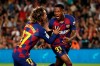 Barcelona's Ansu Fati, right, celebrates with teammate Barcelona's Antoine Griezmann after scoring the opening goal during the Spanish La Liga soccer match between FC Barcelona and Valencia CF at the Camp Nou stadium in Barcelona, Spain, Saturday, Sep. 14, 2019. (AP Photo/Joan Monfort)