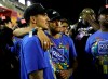 Brazil's soccer player Neymar, center, and surfer Gabriel Medina attend the Carnival celebrations at the Sambadrome in Rio de Janeiro, Brazil, Tuesday, March 5, 2019. (AP Photo/Silvia Izquierdo)