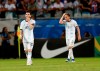 Argentina's Lionel Messi, left, and Argentina's Nicolas Tagliafico walk out of the pitch at the end of the Copa America Group B soccer match against Colombia at the Arena Fonte Nova in Salvador, Brazil, Saturday, June 15, 2019. Colombia won 2-0. (AP Photo/Natacha Pisarenko)