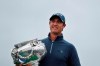 Nicolas Colsaerts of Belgium poses for photographers with the trophy after winning the Amundi French Open, at Le Golf National in Saint-Quentin-en-Yvelines, outside Paris, France, Sunday, Oct. 20, 2019. (AP Photo/Thibault Camus)