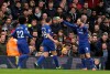 Chelsea's Gonzalo Higuain, right, celebrates with his teammates Cesar Azpilicueta, center and Willian, after scoring his side's opening goal, during the English Premier League soccer match between Fulham and Chelsea at Craven Cottage stadium in London, England, Sunday, March 3, 2019. (AP Photo/Tim Ireland)