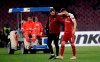 Arsenal's Aaron Ramsey leaves the pitch after his injuring during the Europa League second leg quarterfinal soccer match between Napoli and Arsenal at San Paolo stadium in Naples, Italy, Thursday, April 18, 2019. (AP Photo/Luca Bruno)