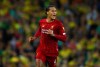 Liverpool's Virgil van Dijk celebrates after scoring his side's third goal during the English Premier League soccer match between Liverpool and Norwich City at Anfield in Liverpool, England, Friday, Aug. 9, 2019. (AP Photo/Dave Thompson)