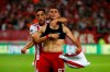 Olympiakos' Lazar Randelovic, right, celebrates after scoring his side's third goal during the Champions League qualifying playoff first leg soccer match between Olympiakos and Krasnodar at Georgios Karaiskakis stadium in Piraeus port, near Athens, Wednesday, Aug. 21, 2019. Olympiakos won 4-0. (AP Photo/Thanassis Stavrakis)
