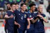 Scotland's John MgGinn, left, celebrates with his teammates after scoring his side's second goal during the Euro 2020 group I qualifying soccer match between Cyprus and Scotland at GSP stadium in Nicosia, Saturday, Nov. 16, 2019. (AP Photo/Petros Karadjias)