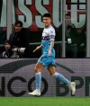 Lazio's Joaquin Correa celebrates after scoring the opening goal of his team during the Italian Cup, second leg semifinal soccer match between AC Milan and Lazio, at the San Siro stadium, in Milan, Italy, Wednesday, April 24, 2019. (AP Photo/Luca Bruno)