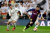 Barcelona forward Lionel Messi, right, controls the ball as Real midfielder Gareth Bale looks on during the Spanish La Liga soccer match between Real Madrid and FC Barcelona at the Bernabeu stadium in Madrid, Saturday, March 2, 2019. (AP Photo/Andrea Comas)
