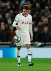 Tottenham's Dele Alli holds the ball after the third goal of Bayern during the Champions League group B soccer match between Tottenham and Bayern Munich at the Tottenham Hotspur stadium in London, Tuesday, Oct. 1, 2019. (AP Photo/Matt Dunham)
