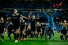 Ajax players celebrate after the Champions League round of 16 second leg soccer match between Real Madrid and Ajax at the Santiago Bernabeu stadium in Madrid, Tuesday, March 5, 2019. Ajax won 4-1. (AP Photo/Bernat Armangue)