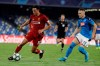 Liverpool's Trent Alexander-Arnold, left, controls the ball as Napoli's Piotr Zielinski looks on during the Champions League Group E soccer match between Napoli and Liverpool, at the San Paolo stadium in Naples, Italy, Tuesday, Sept. 17, 2019. (AP Photo/Gregorio Borgia)