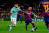 Inter Milan's Marcelo Brozovic, left, tries to stop Barcelona's Lionel Messi during the group F Champions League soccer match between F.C. Barcelona and Inter Milan at the Camp Nou stadium in Barcelona, Spain, Wednesday, Oct. 2, 2019. (AP Photo/Emilio Morenatti)