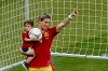 Spain's Fernando Torres holds his son Leo after an award ceremony as Spain won the Euro 2012 soccer championship final between Spain and Italy in Kiev, Ukraine, early Monday, July 2, 2012. (AP Photo/Vadim Ghirda)