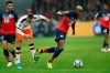 Lille's Victor Osimhen, right, is tackled by Valencia's Denis Cheryshev during the group H Champions League soccer match between Lille and Valencia at the Stade Pierre Mauroy - Villeneuve d'Ascq stadium in Lille, France, Wednesday, Oct. 23, 2019. (AP Photo/Michel Spingler)
