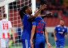 Olympiakos' Ruben Semedo, left, celebrates with Yassine Meriah after scoring his side's first goal during the Champions League group B soccer match between Red Star and Olympiacos, in Belgrade, Serbia, Tuesday, Oct.1, 2019. (AP Photo/Darko Vojinovic)