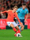 Netherlands' Frenkie de Jong, left, challenges for the ball with Northern Ireland's Paddy McNair during the Euro 2020 group C qualifying soccer match between The Netherlands and Northern Ireland at De Kuip stadium in Rotterdam, Netherlands, Thursday, Oct. 10, 2019. (AP Photo/Peter Dejong)